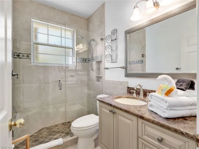 Bathroom with vanity and a shower stall