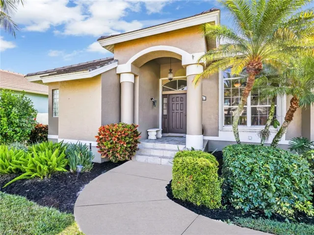View of exterior entry with stucco siding