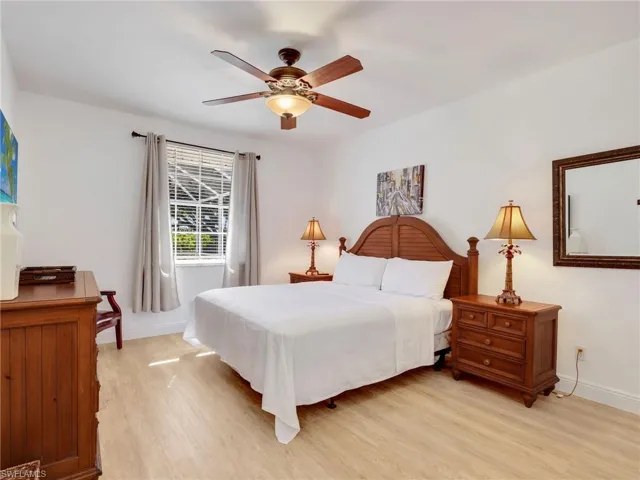Bedroom with light wood-type flooring and ceiling fan