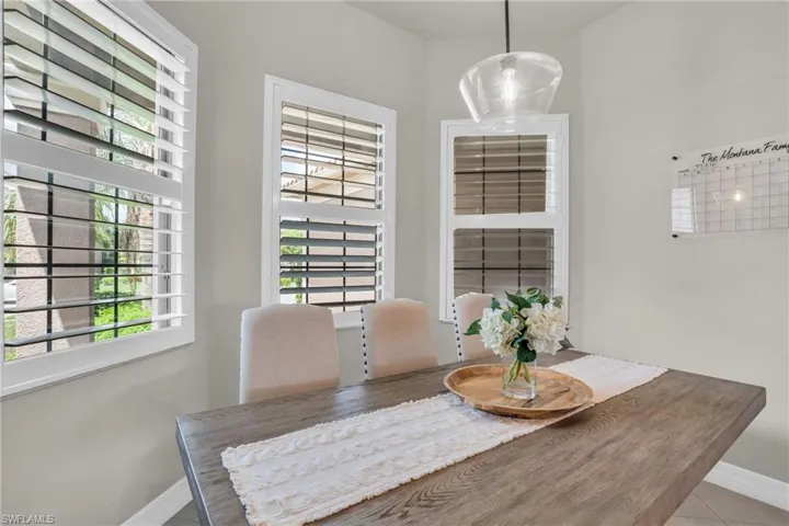 Tiled dining room with a wealth of natural light