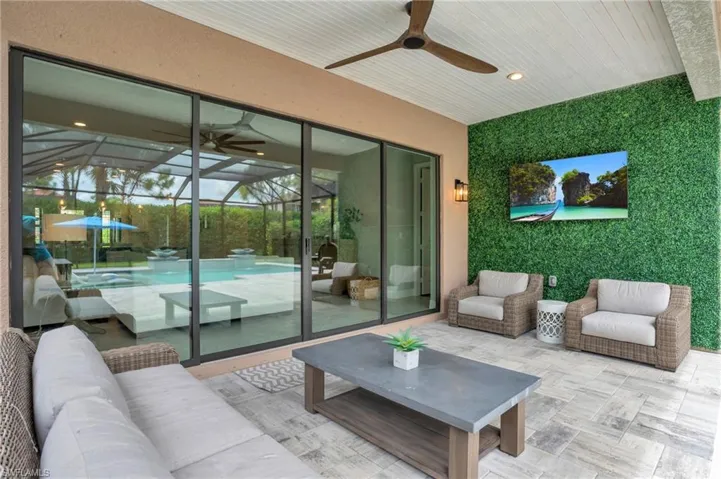 View of patio / terrace featuring an outdoor living space and ceiling fan
