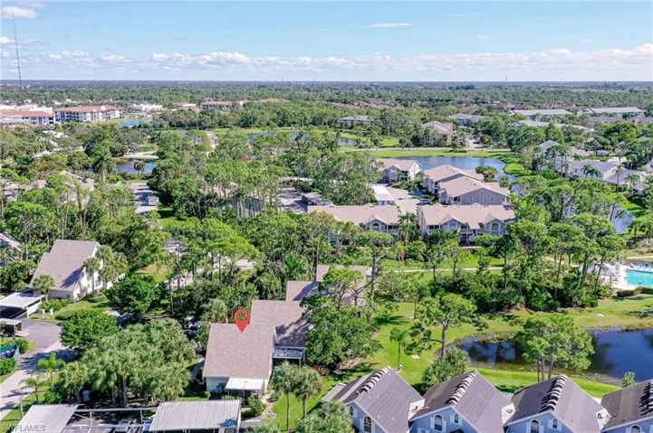 Aerial of Home with community pool nearby.