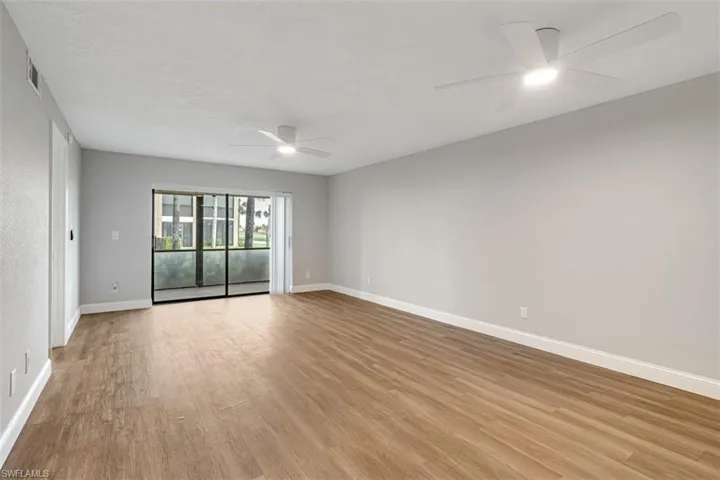 Spare room with ceiling fan and light wood-style flooring