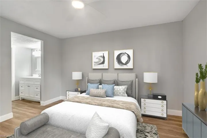 Bedroom featuring wood finished floors, connected bathroom, and ceiling fan