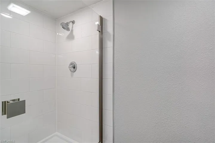 Bathroom featuring tiled shower