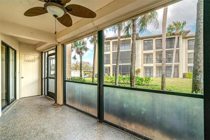 Unfurnished sunroom with a ceiling fan