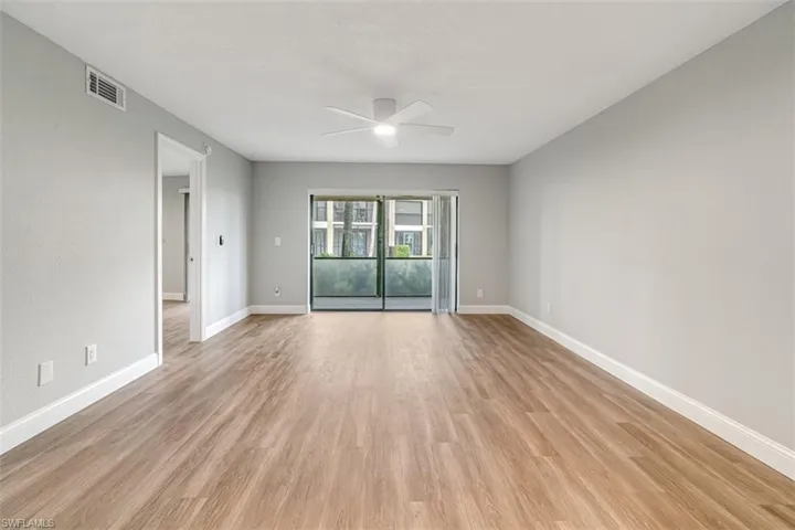Unfurnished room featuring a ceiling fan and light wood finished floors
