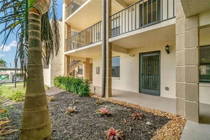 Property entrance with stucco siding