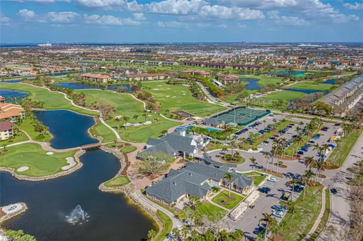 Aerial overview of property's location with a large body of water and a golf club