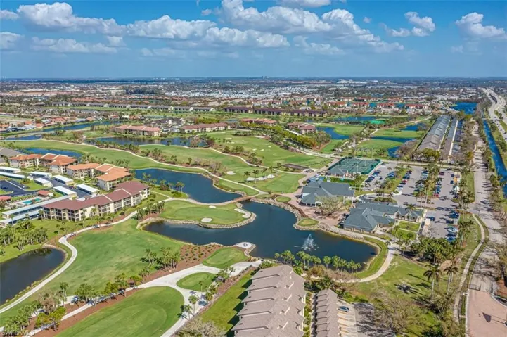 Aerial view of property's location with a large body of water and a golf course