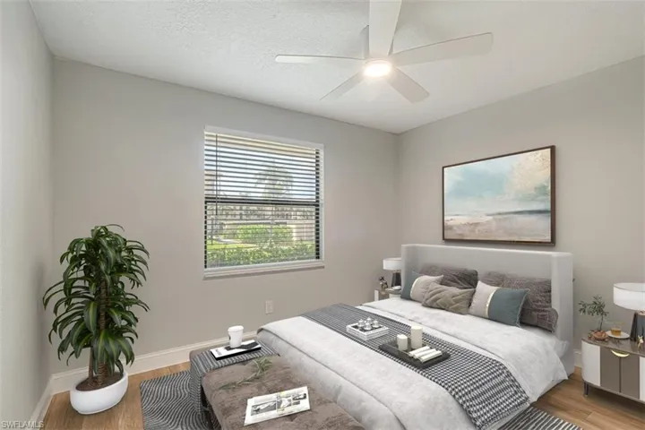 Bedroom featuring light wood finished floors and ceiling fan