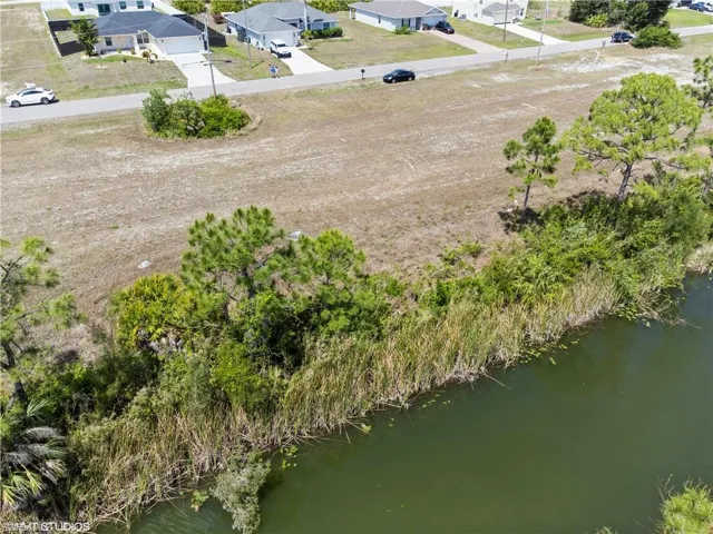 Bird's eye view featuring a water view and a residential view