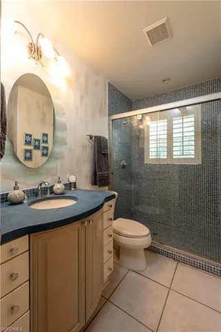 Ground Floor Bathroom with glass tile Shower