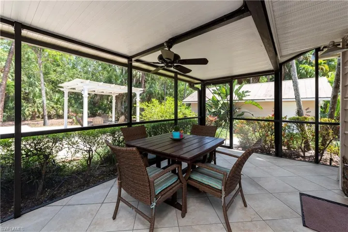 Covered and Screened Lanai with ceiling fans and gas grill