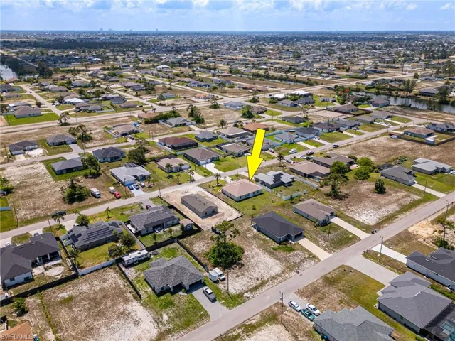Aerial overview of property's location featuring nearby suburban area