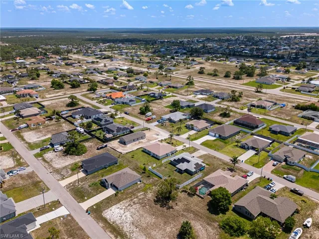 View of property location with nearby suburban area