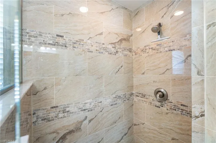 Bathroom featuring tiled shower