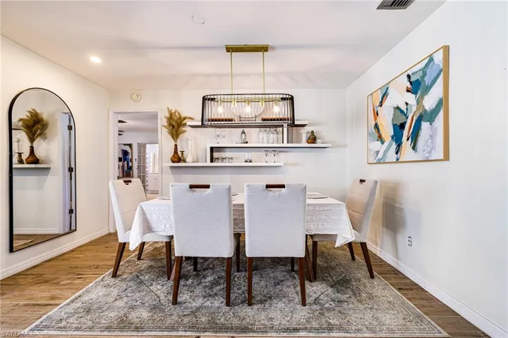 Dining area featuring wood finished floors and recessed lighting