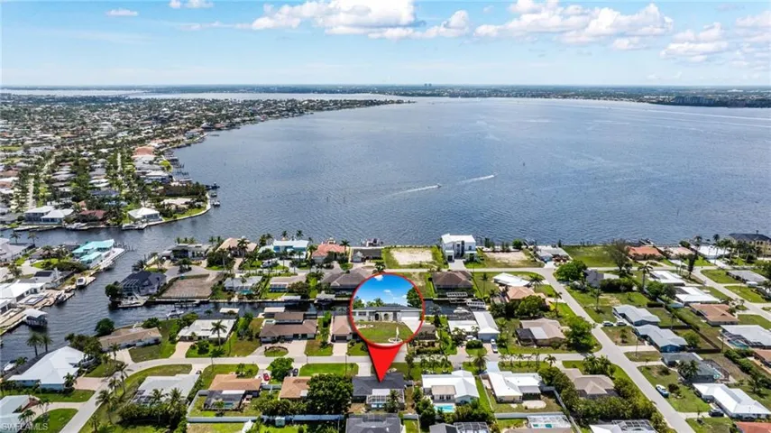 Aerial perspective of suburban area with a large body of water