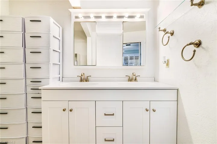 Full bathroom featuring double vanity