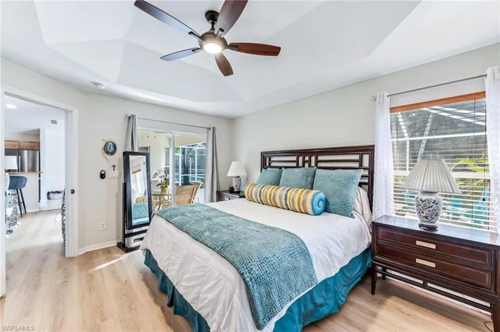 Master Bedroom with slider to lanai/pool area