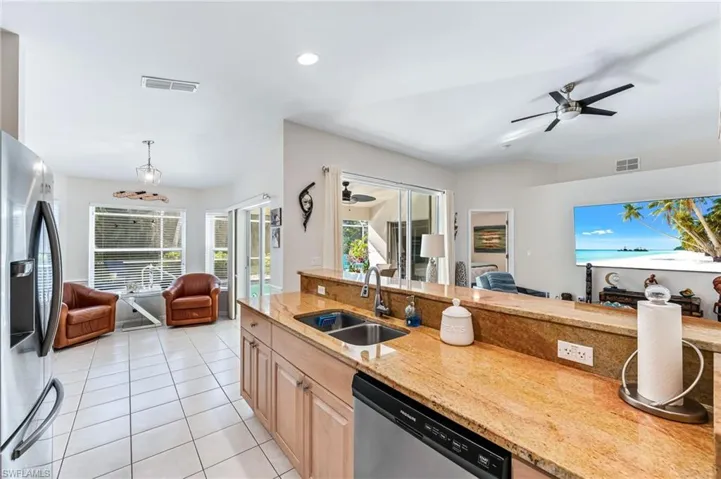 View from kitchen to breakfast area and living room