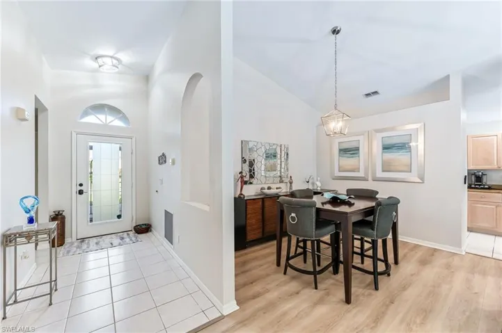 Foyer entrance open to living and dining area