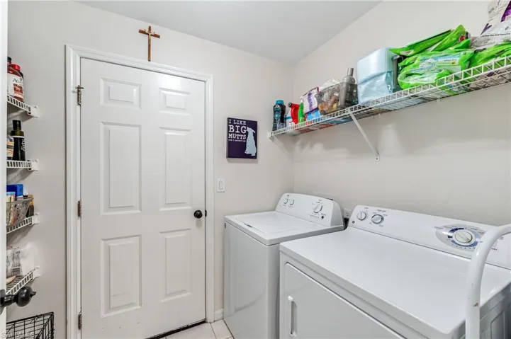 Laundry area featuring laundry area and washer and clothes dryer