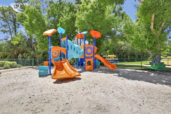 Community jungle gym featuring fence