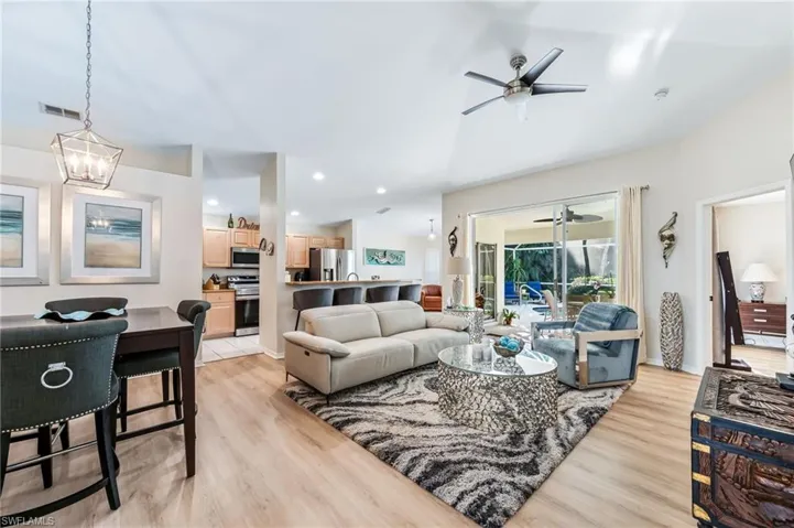 Living room with LTV flooring, updated lighting and ceiling fan