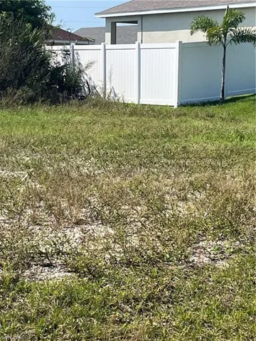 View of yard featuring fence