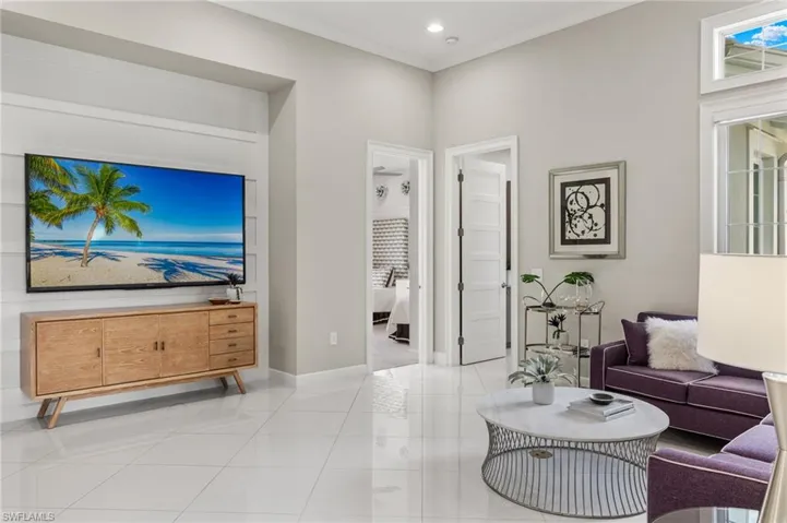 Living room with light tile patterned flooring