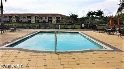 Community pool featuring a patio