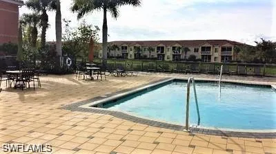 Community pool featuring a patio area