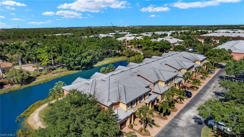 Drone / aerial view of a large body of water and a tree filled landscape