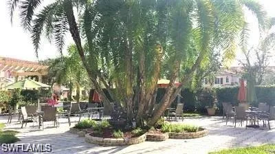 View of property's community with a patio area and a pergola