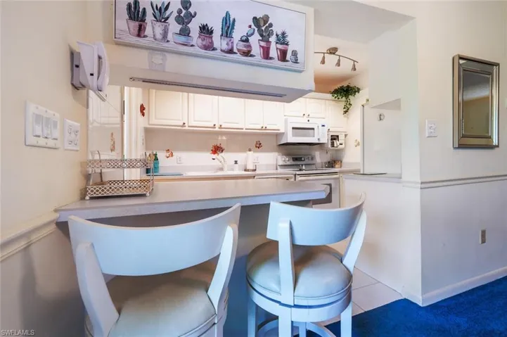 Looking into convenient galley kitchen.