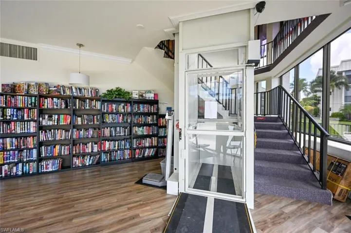 In-house library.  Take lift or stairs to second floor.