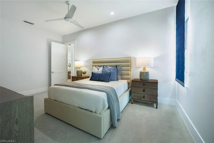 Bedroom with carpet floors, a ceiling fan, and recessed lighting