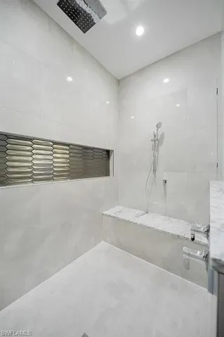 Full bathroom with a tile shower