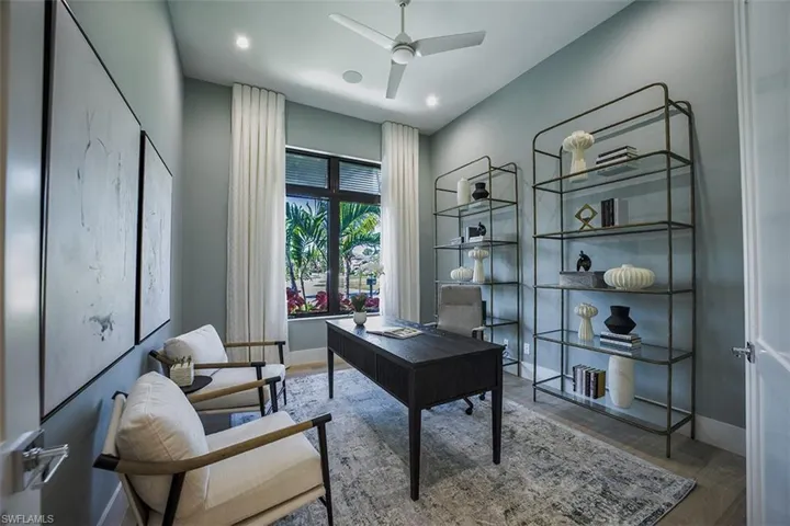 Office space featuring light wood-style flooring and ceiling fan