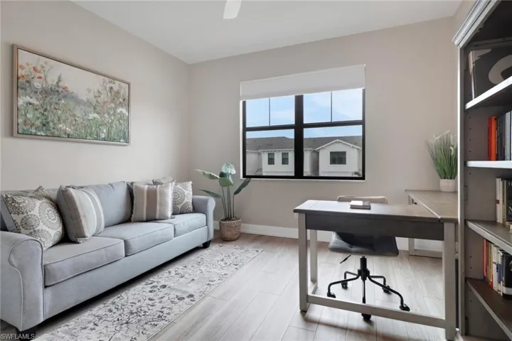 Home office with baseboards and light wood finished floors