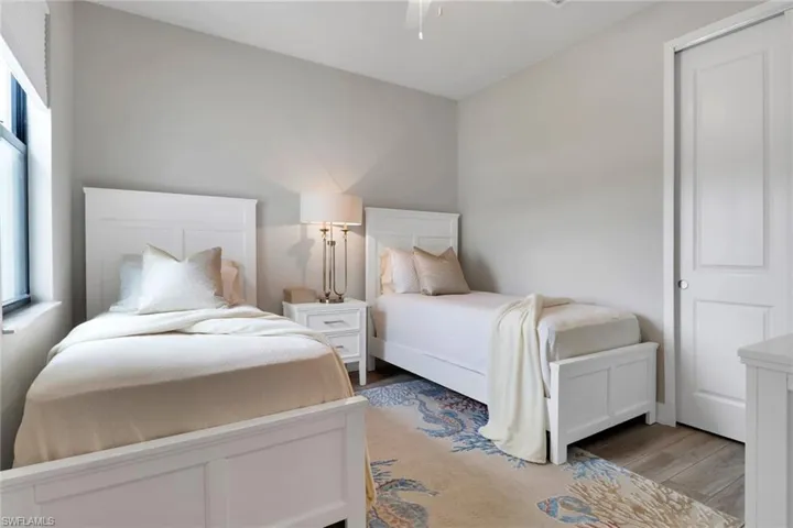 Bedroom with light wood-style flooring and ceiling fan
