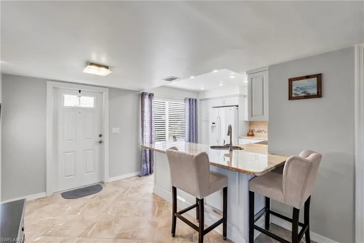 Dining space with a healthy amount of sunlight and sink