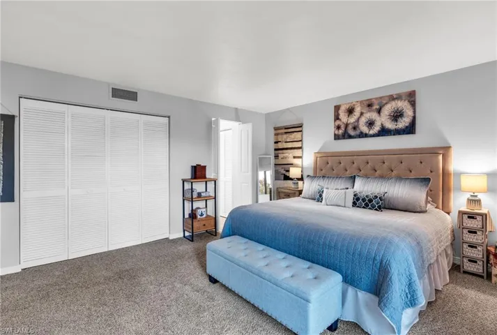 Bedroom with carpet flooring and a closet