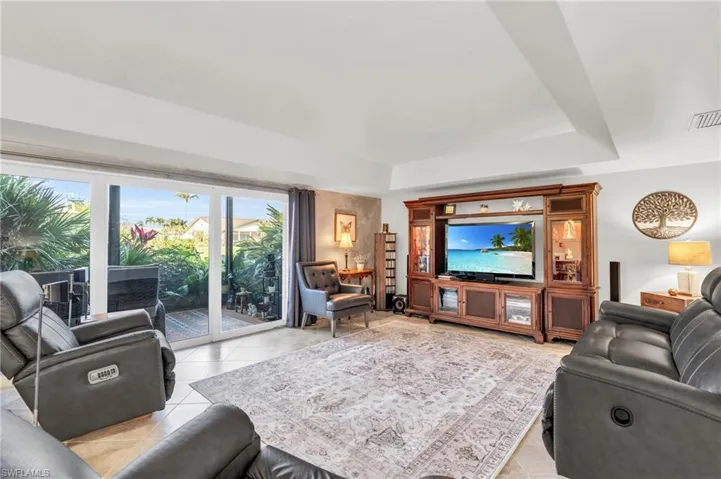 Living room featuring light tile patterned floors