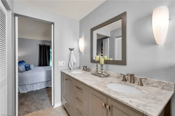 Bathroom with vanity and tile patterned flooring