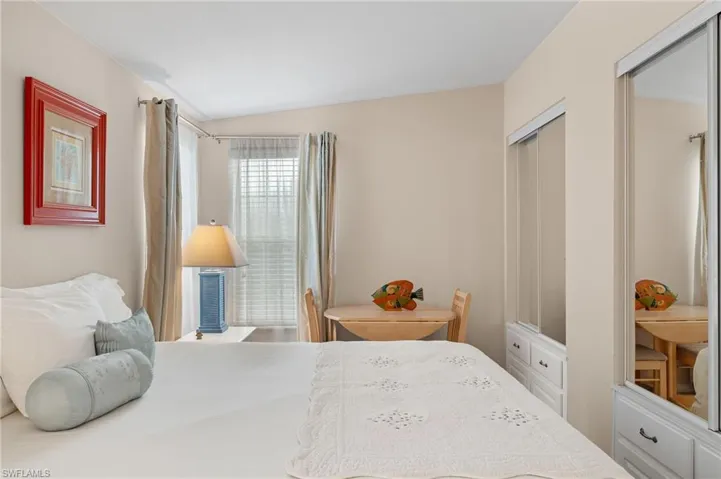 Bedroom with a closet and vaulted ceiling