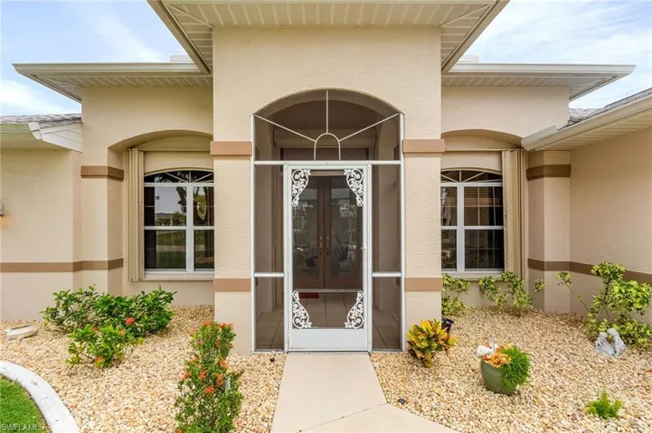 View of doorway to property w/ screened entry for those cool nights.