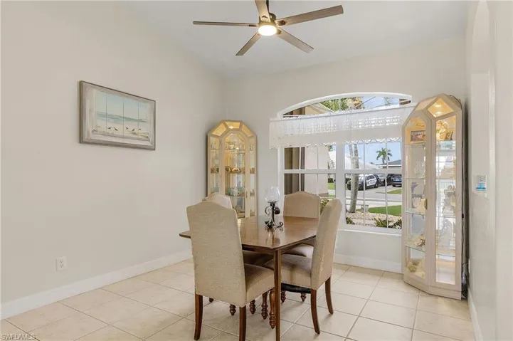 Dining area featuring , ceiling fan, and light tile patterned floors